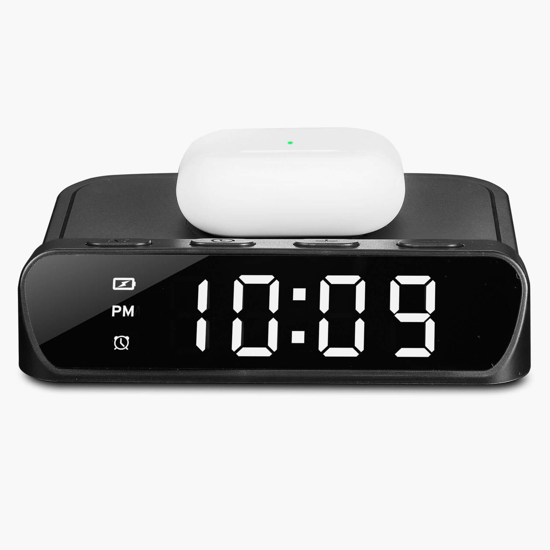 Black Timex TW14B alarm clock with digital display showing 10:09, wireless charger with AirPods on top, sleek space-saving design.